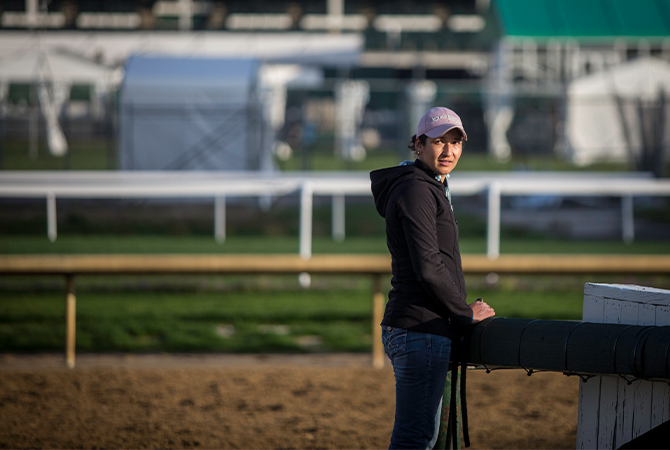 A header image of Bertila Quinteros on the backside of the Derby racetrack.