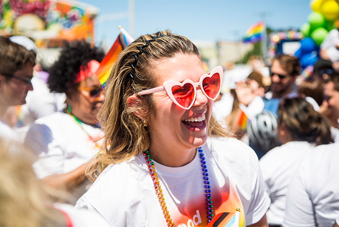 Detail image of a person wearing heart-shaped sunglasses for June 2023 Celebrating Pride story.